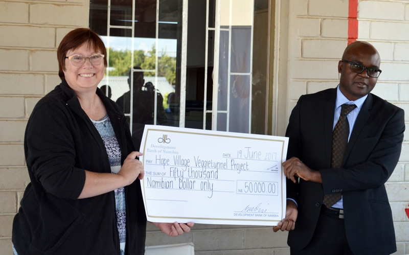 DBN has great expectations for Hope Village. DBN CEO Martin Inkumbi, pictured with Hope Village Director Marietjie de Klerk, recently donated N$50,000 to Hope Village for construction of Veggietunnels which will grow food for the orphans and vulnerable children of the center, and the surrounding community.