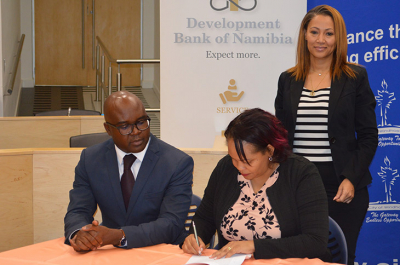 DBN CEO Martin Inkumbi and Chairperson of the Windhoek Management Council Illse Keister sign an agreement to provide N$155 million finance for a new substation to ensure Windhoek’s sustainability. DBN Acting Head of Investments Heroldine Carstens looks on.