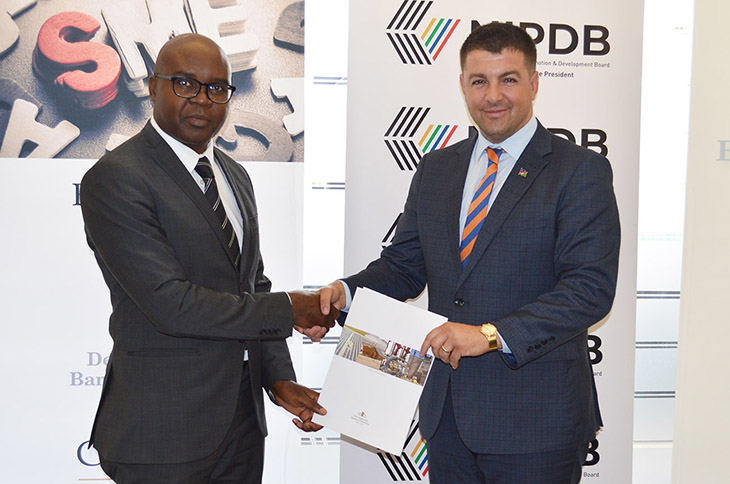 DBN CEO Martin Inkumbi, and Dino Ballotti, NIPDB Executive Director responsible for MSME Development, sign a landmark agreement to cooperate on providing an enabling environment for SMEs.